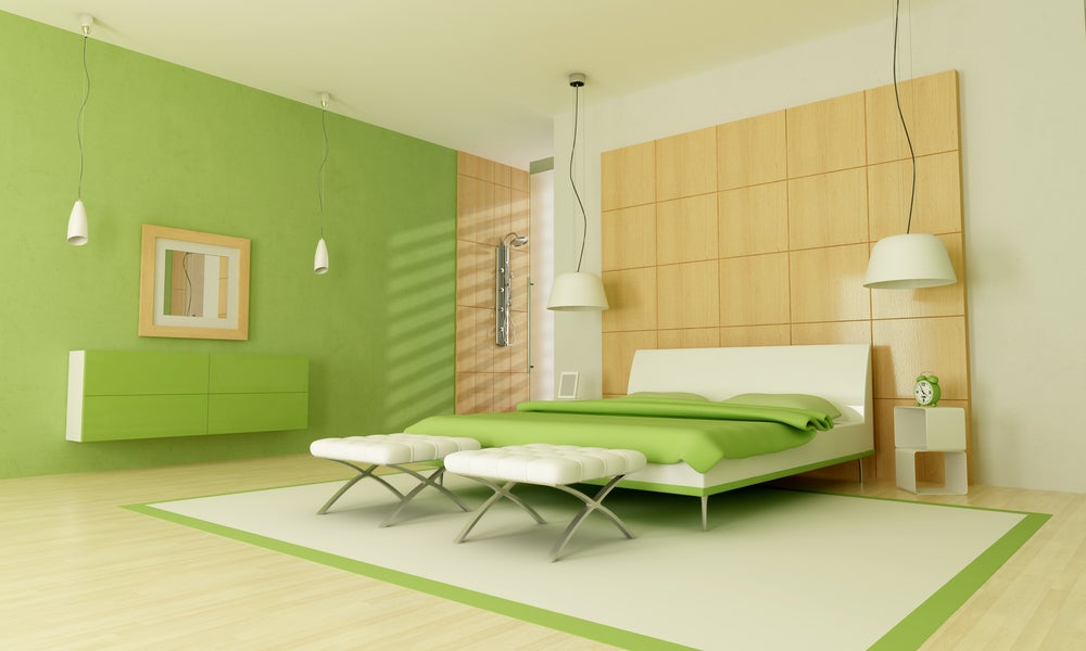 Phòng ngủ tông màu xanh lá cây.